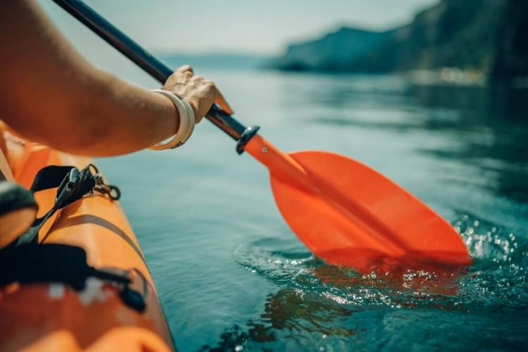 person in kayak on the water