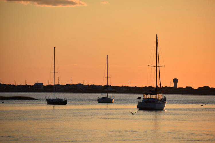 boats on the water at sunset