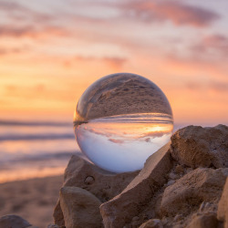 Glass ball reflecting sand on the beach | Sun-Surf Vacation Rentals Emerald Isle NC