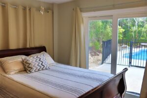 The bedroom of an Emerald Isle rental to stay at when visiting the seafood festival in Morehead City.